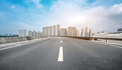 Obraz premium Road ground and modern architectural landscape skyline of Chinese city