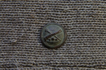 The vintage brass army button