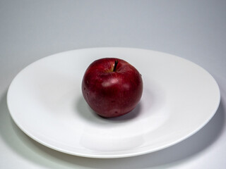 red apples on a plate