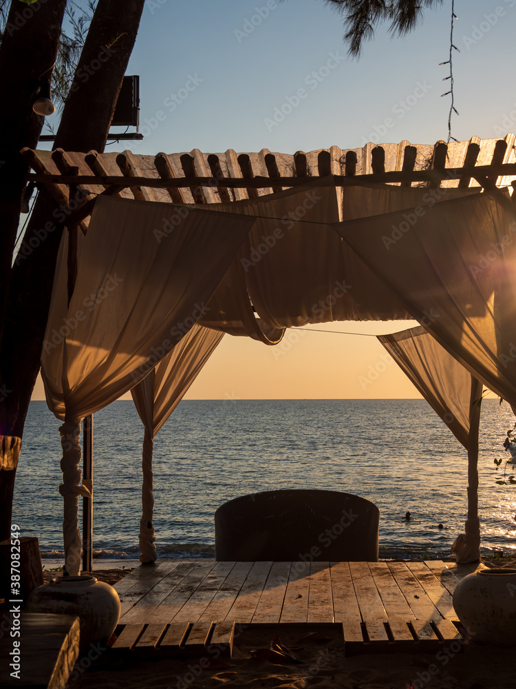 Wall mural Thailand beach bar at sunset