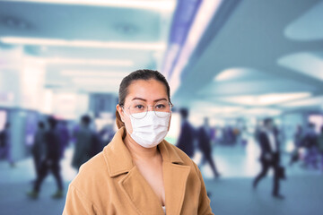 Asian women with face mask traveling while COVID-19 outbreaks.