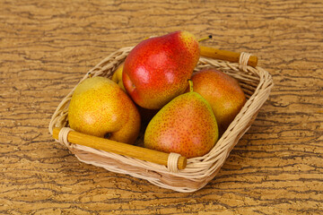 Pear heap in the wooden basket