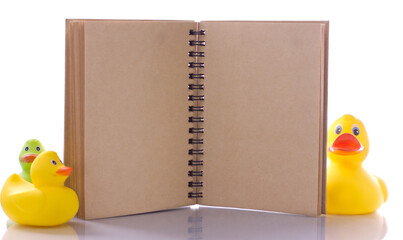 spiral craft notebook for business concept with ducks on white background