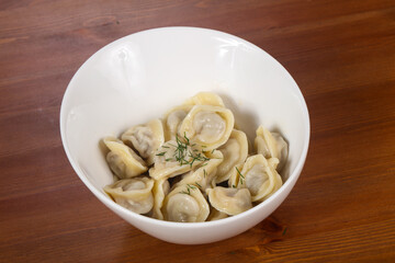 Russian traditional dumplings in the bowl