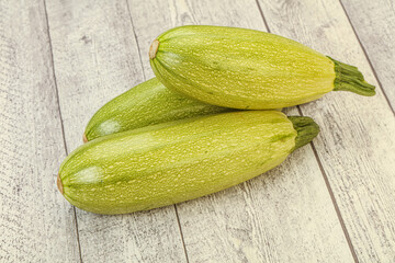 Young tasty zucchini over board