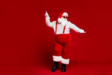 Fototapeta na wymiar Full length body size view of his he attractive cool funny playful fat white-haired Santa having fun dancing rock day isolated bright vivid shine vibrant red burgundy maroon color background