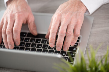 Fototapeta na wymiar Male hands working on laptop