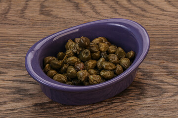 Tasty capers in the bowl