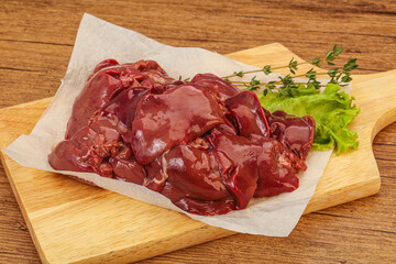 Raw chicken liver over board