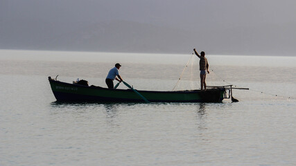 Fishing boats on the coast, fishing industry, workers on a fishing boat