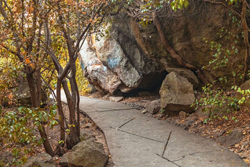 Path in the autumn Park. The rocky landscape
