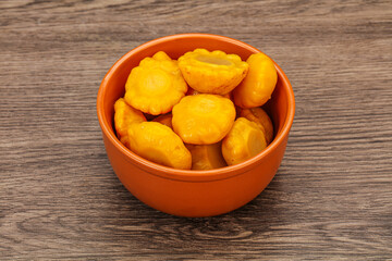 Marinated yellow patisson in the bowl