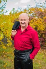 Naklejka na ściany i meble Elegant suit with marsala shirt and black jacket for seniors , lifestyle of older people