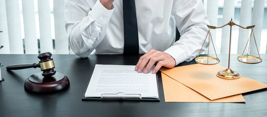 Male lawyer working with legal case document contract in office, law and justice, attorney, lawsuit...