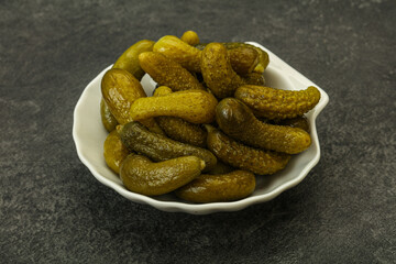 Pickled gherkin in the bowl