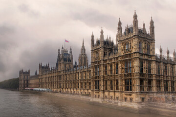 Fototapeta na wymiar Houses of Parliament on the River Thames - with storm clouds.