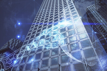 Double exposure of technology theme hologram and cityscape background. Concept of Hightech.