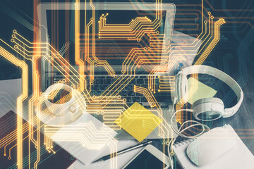 Computer on desktop in office with technology theme hologram. Double exposure. Tech concept.