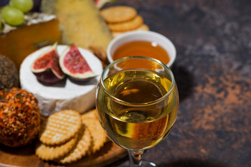 gourmet cheeses with a glass of white wine