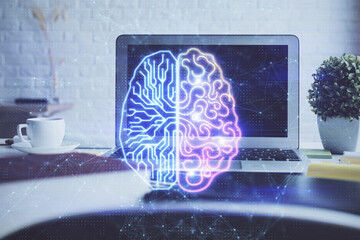 Double exposure of work space with computer and human brain drawing hologram. Brainstorm concept.