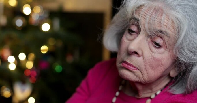 Sad And Lonley Senior Woman Unhappy About Spending Christmas At Home Alone