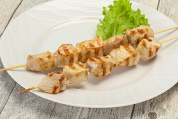 Grilled pork skewer served salad