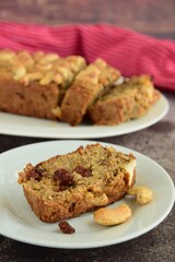 Raisin cashew loaf cake. Delicious dessert. Blurred background