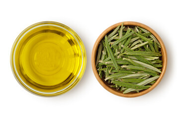 Virgin olive oil in glass bowl and fresh rosemary leaves in wooden bowl on white background