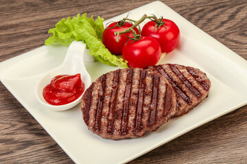 Grilled burger cutlet with sauce
