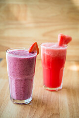 two Fruit shakes, watermelon and mixed berry