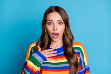 Fototapeta premium Close-up portrait of her she nice attractive lovely wondered impressed brown-haired girl wearing casual sweater good news reaction isolated bright vivid shine vibrant blue color background