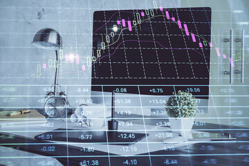Stock market chart hologram drawn on personal computer background. Double exposure. Concept of investment.