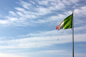 Rotten italian flag on corona empty beach in forte dei marmi, tuscany, italy