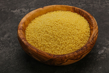 Raw cous cous heap in the bowl