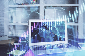 Stock market chart hologram drawn on personal computer background. Multi exposure. Concept of investment.