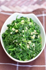 Sauteed garlic spinach. Healthy diet vegetarian