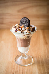 chocolate ice-cream sundae with biscuit on top for décor