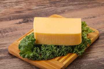 Tasty yelloow Tilsiter cheese brick