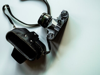 Old film camera on white background