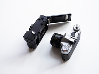 Details of an old film camera on a white background