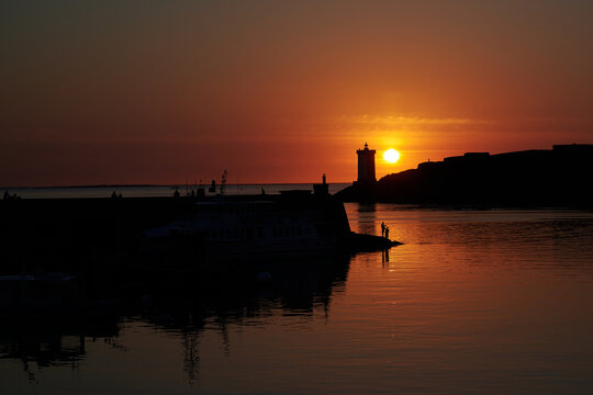 Angler im Sonnenuntergang