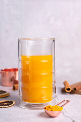 selective focus. honey cake with delicate cream. on a light background with craft paper. in the background is a jar of light honey