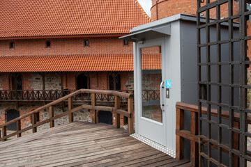 Inner yard of the Trakai Island Castle. Special elevator for the disabled.