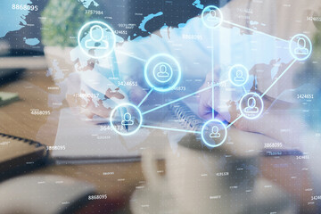 Social network theme hologram over woman's hands writing background. Concept of international people connect. Double exposure