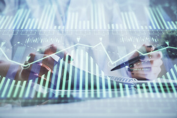 Multi exposure of hands making notes with digital coding icons. Computer learning concept.