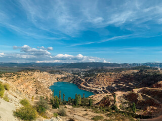 Naklejka premium beautiful quarry landscape with lake and blue sky