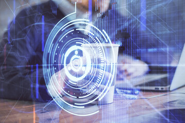 Double exposure of data internet theme hologram with man working on computer on background. Concept of innovation.