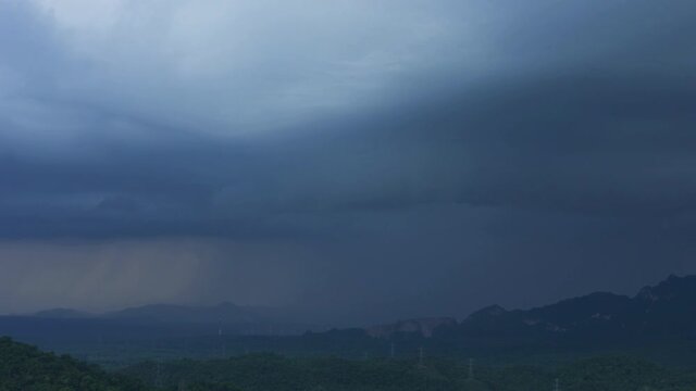 4K time lapse video, rain storms and black clouds moving over the mountains In the north of Thailand, Mae Moh district, Lampang.