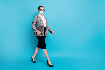 Fototapeta na wymiar Full length photo of nice lady leader carrying laptop going on meeting wear mask isolated on bright blue color background