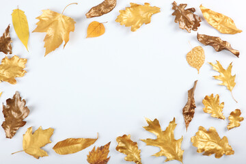 Beautiful stylish autumn background with golden leaves top view with place for text